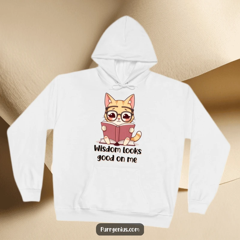Funny hoodie with a cute, studious cat wearing glasses, engrossed in reading a large book, perfect for literary enthusiasts.