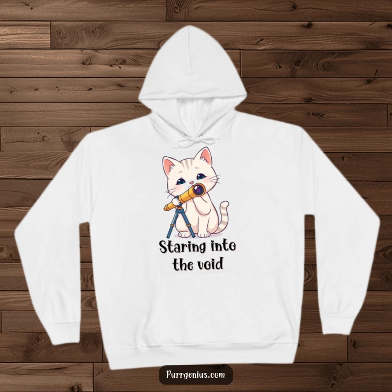 Funny cat with a tiny telescope, exploring the night sky, printed on a soft hoodie, perfect for cozy nights and laughter.